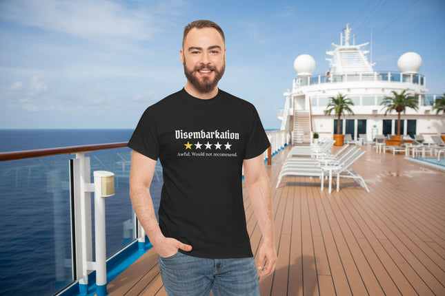 Man wearing a black t-shirt with text  that says "Disembarkation and a 1-star rating on a ship deck