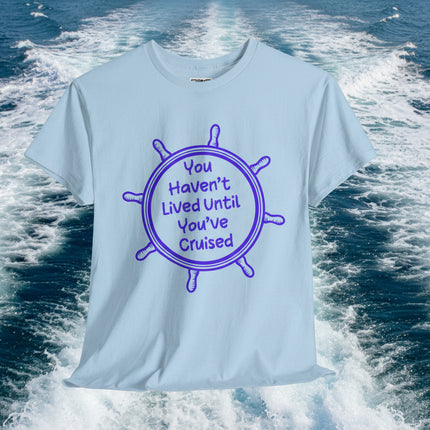 blue t-shirt with purple graphic and "You Haven't Lived Until You've Cruised" text on a boat with ocean and sky background