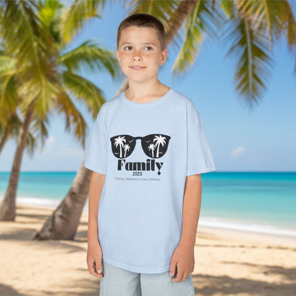 Child wearing a light blue t-shirt with sunglasses and personalized Family vacation text
