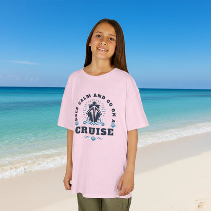 Young girl wearing a pink t-shirt with 'Keep Calm and Go on a Cruise' text and graphic.