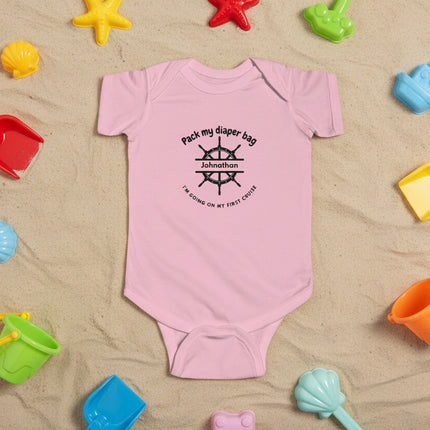 Pink personalized baby onesie with black "Pack My Diaper Bag" text and ship steering wheel graphic